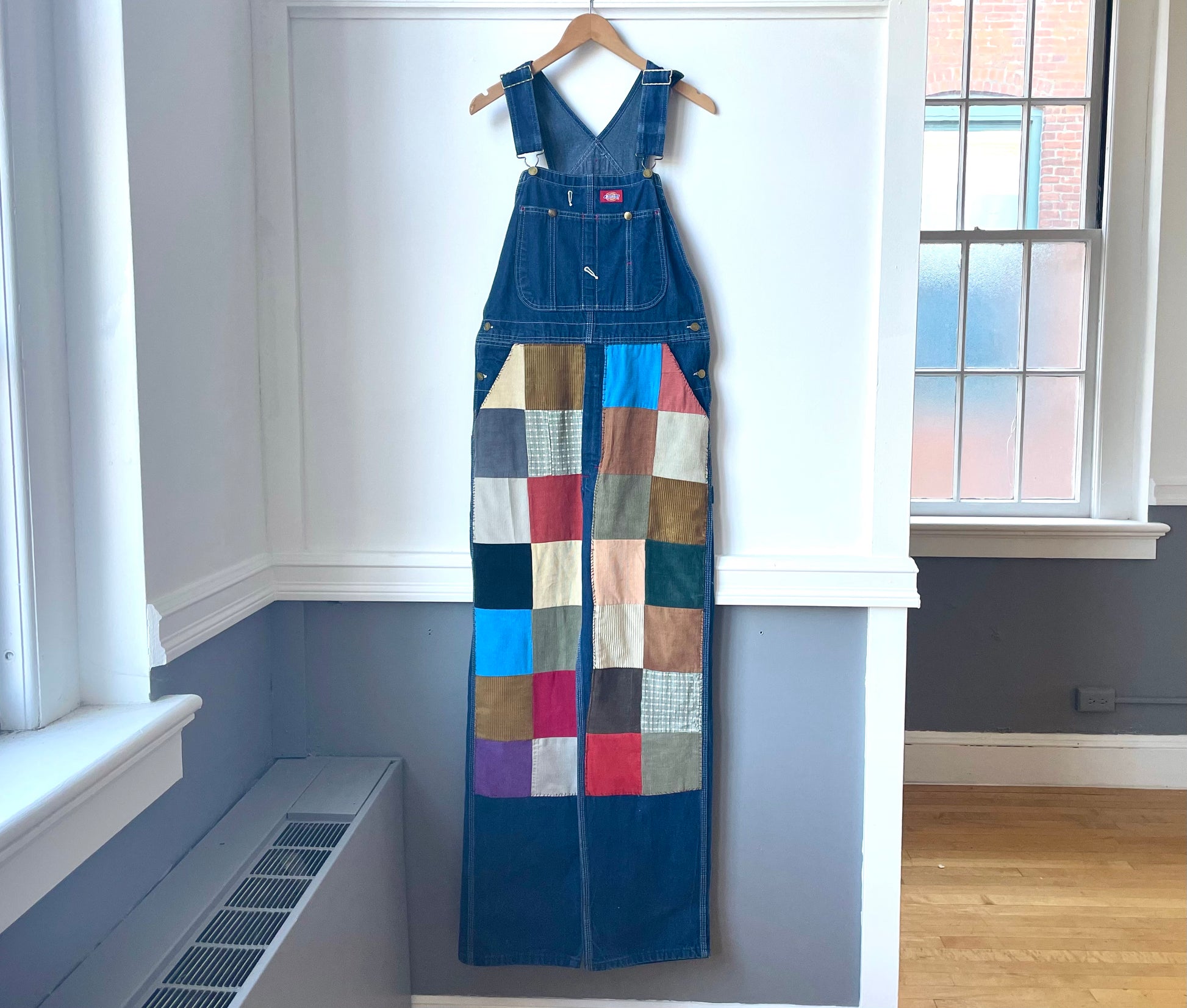 a dress hanging on a wall in a room