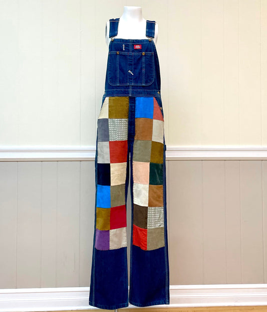 a mannequin wearing a patchwork denim jumpsuit